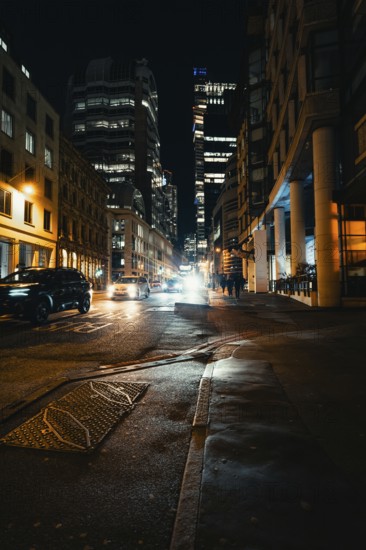 City view at night with illuminated buildings, moving cars and street lamps, London, United Kingdom, World