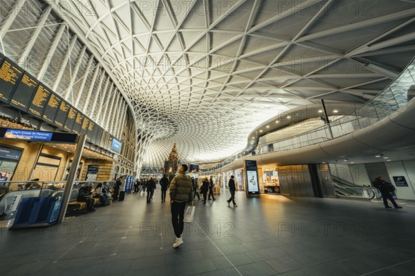 Bright and spacious train station with modern glass architecture and busy travelers, King's Cross Station, London, United Kingdom, World