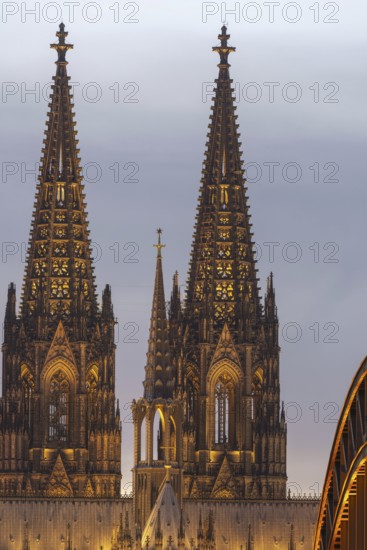 Evening atmosphere, Cologne Cathedral illuminated with LED lamps and the Hohenzollern Bridge, Cologne, North Rhine-Westphalia, Germany