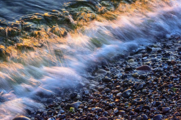 Wave play at sunrise on the chalk coast in Jasmund National Park, Rügen, Sassnitz, Mecklenburg-Western Pomerania, Germany
