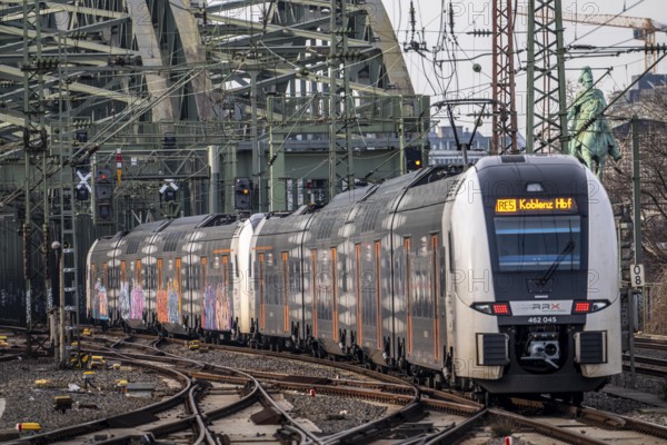 Rail system in front of Cologne Central Station, Hohenzollern Bridge across the Rhine, RRX, Rhine-Ruhr Express, regional train, regional trains, in front of the railway bridge, Cologne, North Rhine-Westphalia, Germany