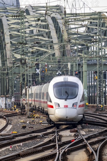 Rail track in front of Cologne Central Station, Hohenzollern Bridge across the Rhine, ICE long-distance trains in front of the railway bridge, Cologne, North Rhine-Westphalia, Germany