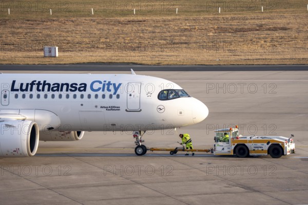 Lufthansa City Airbus A320neo is pushed from the gate onto the taxiway, ready to go, to Cologne/Bonn Airport, CGN, North Rhine-Westphalia, Germany