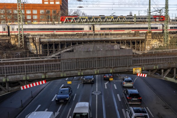 ICE and S-Bahn train on the line, railway bridge over Deutz-Mülheimer-Straße, more than 10 tracks crosses the road on 6 bridge structures, platform tracks in front of Cologne-Messe/Deutz station, North Rhine-Westphalia, Germany