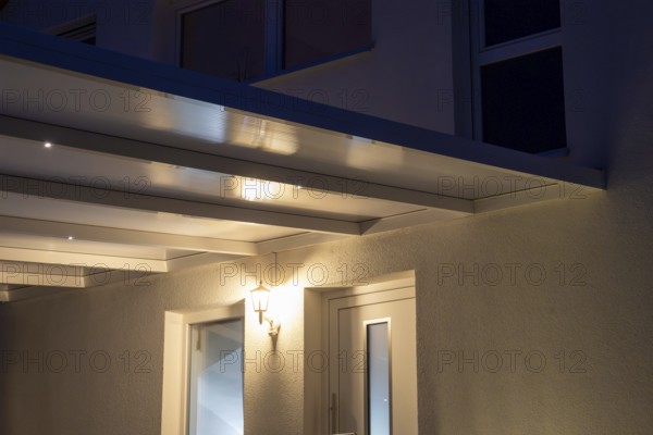 Modern entrance canopy with integrated LED lighting for an inviting house entrance
