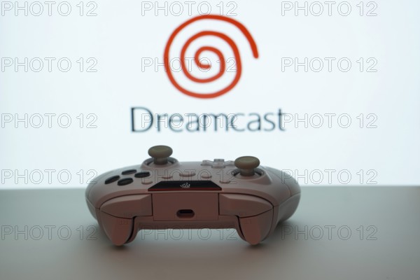 Dhaka, Bangladesh- 08 Apr 2025: A gaming controller in front of a Dreamcast screen