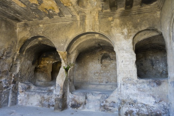 Ancient cave with stone arches and interior details, historic setting, Tamaris Darbasi, Tamaras Hall, Uplistsikhe cave town, Uplistsikhe, Inner Kartli region, Shida Kartli, Georgia