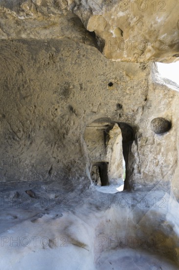 Rough stone cave walls with light and shadow effects inside, cave town Uplistsikhe, Inner Kartli region, Shida Kartli, Georgia