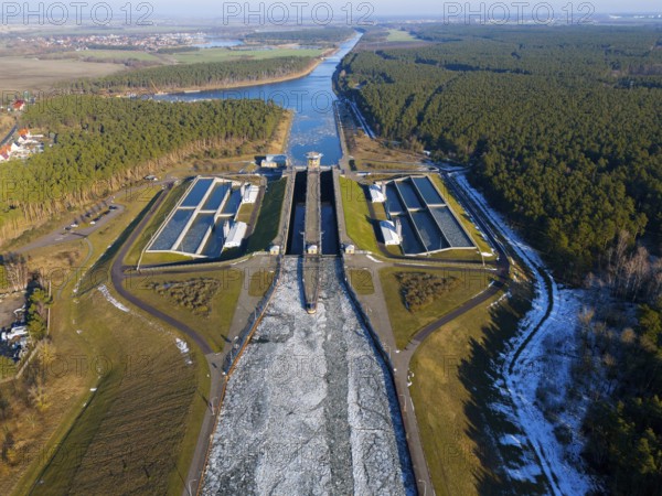 Aerial view of a lock surrounded by forests, surrounded by ice-covered waterways, aerial view, Hohenwarthe lock, Elbe-Havel Canal, Jerichower Land, Saxony-Anhalt, Germany