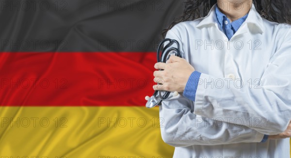Healthcare professional with Germany flag background. Professional doctor holding stethoscope on Germany flag background