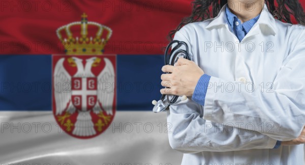 Healthcare professional with Serbia flag background. Professional doctor holding stethoscope on Serbia flag background