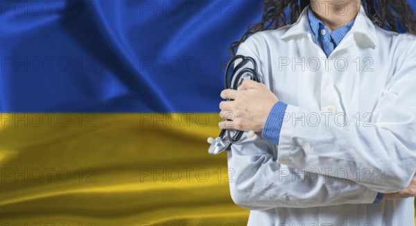 Healthcare professional with Ukraine flag background. Professional doctor holding stethoscope on Ukraine flag background
