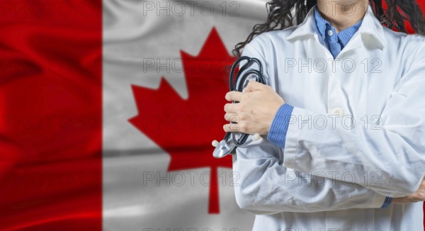 Healthcare professional with Canada flag background. Professional doctor holding stethoscope on Canada flag background