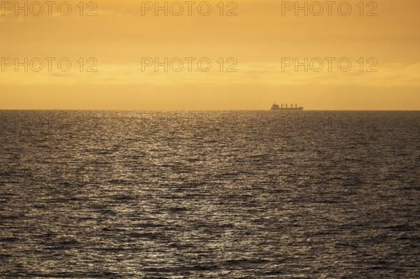 Silhouette, cargo ship, evening light, Baltic Sea