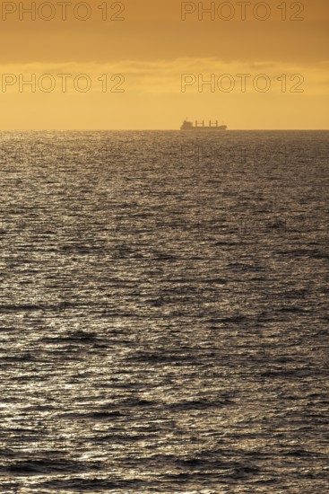 Silhouette, cargo ship, evening light, Baltic Sea
