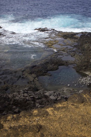 Coastal scene with rocks and waves hitting the cliffs. Dynamic natural scenery, Yaiza Lanzarote