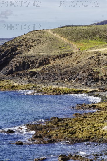 Coast with rugged hills and a hiking trail that snakes through the countryside, Puerto Calero Lanzarote