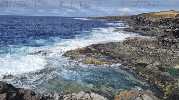 Rugged coastal area with thundering waves, rugged rocks and sweeping views over the sea, Yaiza Lanzarote