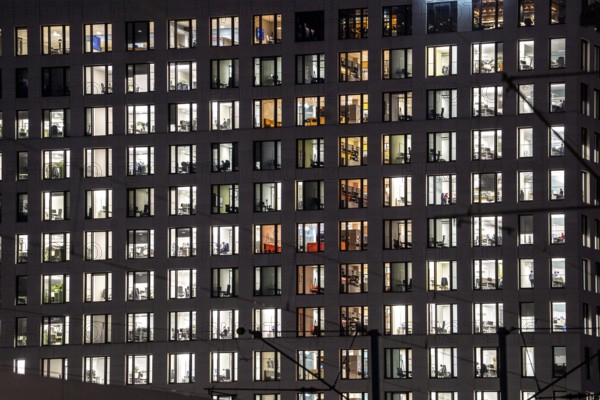 Office building, many windows are illuminated, Cologne, North Rhine-Westphalia, Germany