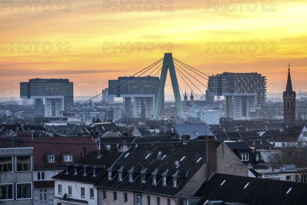 View over the city center of Cologne, residential buildings in Cologne-Deutz in front, pillar of the Severin Bridge, across the Rhine, crane houses in Rheinauenhafen, North Rhine-Westphalia, Germany