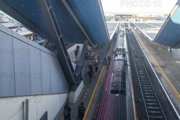 Modern architecture looking down on Class 220 Voyager diesel-electric multiple unit train, Reading railway station, Berkshire, England, UK