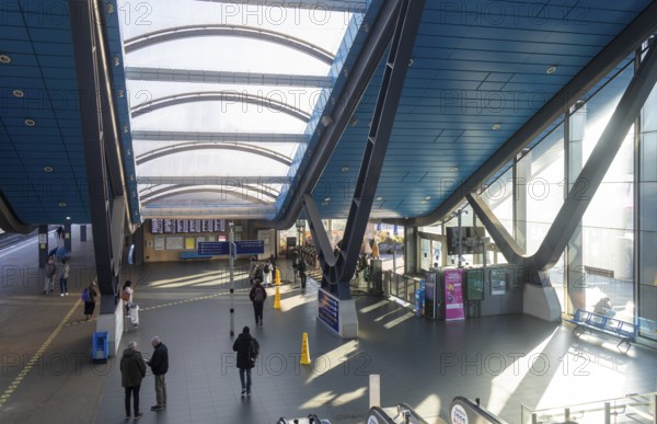 View from escalator of modern architecture of railway station concourse building, Reading, Berkshire, England, UK