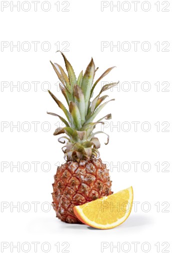 Fresh pineapple and orange slices arranged on a white background, vertical, no people