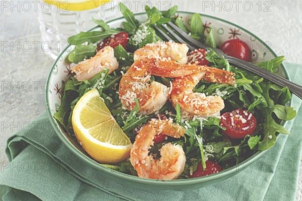 Shrimp salad with arugula and cherry tomatoes, with parmesan cheese, healthy food