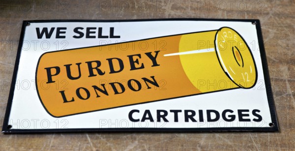 Enamel vintage reproduction advertising sign for Purdey London shotgun cartridges, UK
