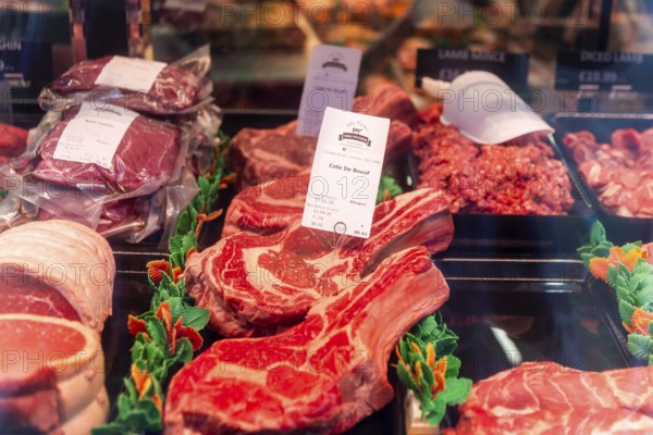 Cote De Boeuf and other meat products in Toby Haynes Family Butcher shop window, Wiltshire, England, UK