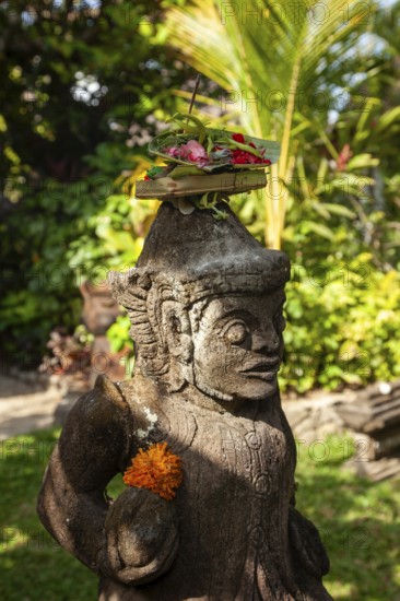 Canang Sari is a Balinese offering that expresses the Sang Hyang Widhi Wasa (God) or the creators of life. The offerings are made to maintain balance and peace on earth, between good and evil, between gods and demons, between heaven and hell, Kuta beach, Bali, Indonesia