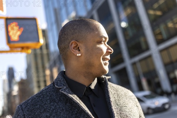 Professional man confidently walking through the vibrant city streets, looking ahead with a happy expression, portraying successful downtown business lifestyle