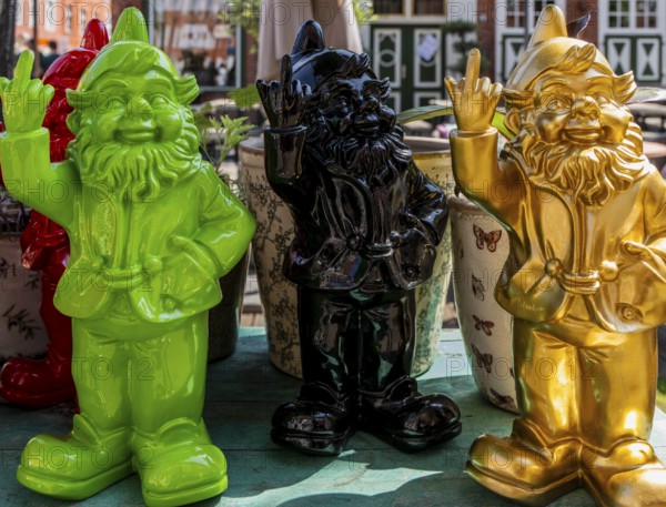 Colored garden gnomes, decoration in front of a shop in downtown Potsdam, Brandenburg, Germany