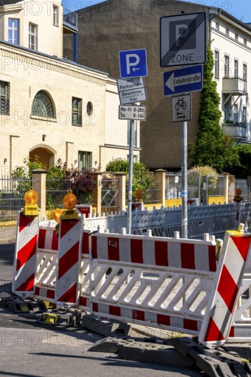 Barriers and traffic signs at a road construction site in the city center of Potsdam, Brandenburg, Germany