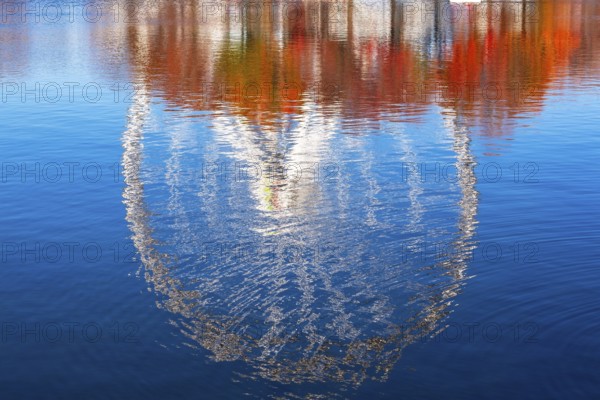 The Montreal Observation Ferris Wheel reflected in Bassin Bonsecours in autumn, Old Port of Montreal, Quebec, Canada. George Ferris (1859–96), is the American engineer who invented the ferris wheel