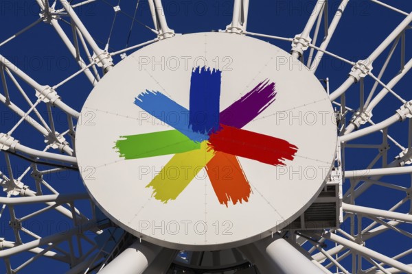 Symbolic LGBTQ+ rainbow flag colours on The Montreal Observation Ferris Wheel or La Grande Roue de Montreal amusement ride, Old Port of Montreal, Quebec, Canada