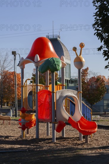 Colorful kids plastic playground equipment with slides and climbing bars in Parc du Bassin Bonsecours, Old Port of Montreal, Quebec, Canada