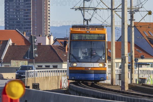 Tram on the Kurt Schumacher Bridge, which connects Mannheim and Ludwigshafen across the Rhine. The tram network is operated by Rhein-Neckar-Verkehr GmbH (RNV) . Mannheim, Baden-Württemberg, Germany