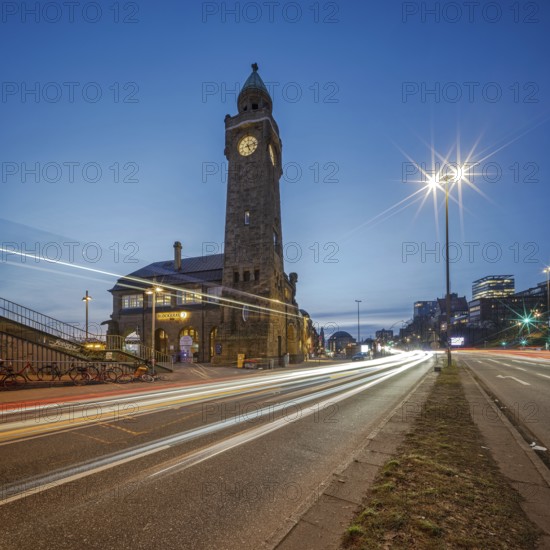 Hamburg piers with water level tower at night and traffic light trails, Hamburg, Germany