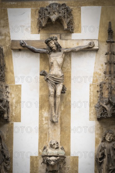 Christ sculpture from the former monastery church of S. Johannes Baptistam above portal of the monastery church, Blaubeuren Abbey, Swabian Jura, Baden-Württemberg, Germany