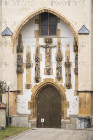 Christ sculpture and remains of the former monastery church of S. Johannes Baptistam above portal of the monastery church, Blaubeuren Abbey, Swabian Alb, Baden-Württemberg, Germany