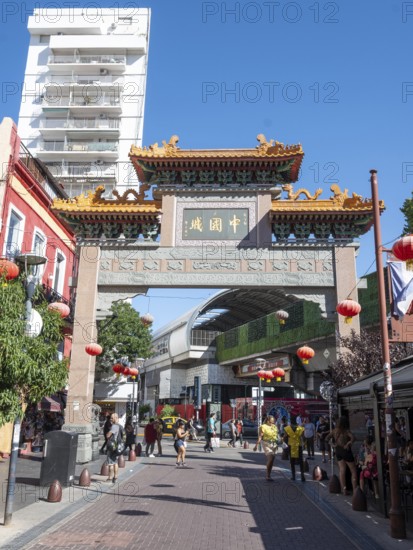 Tourists stroll in Chinatown with the Chinese archway, Buenos Aires, Argentina