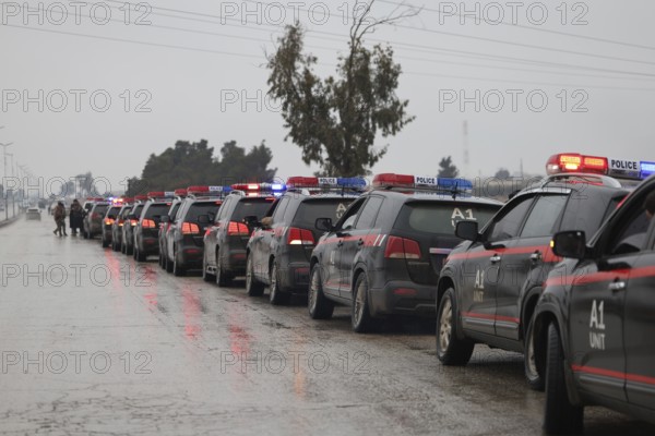 In Al Tabqah, Syria on January 18, 2026, a convoy of Syrian Government forces deploys throughout the city following the withdrawal of SDF forces. Local civilians are seen gathering in the streets to welcome the troops with celebrations, marking the return of government control to this strategic city in northeast Syria, Raqqa, Tabqah, Syria