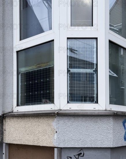 Window front, bay window with solar panels used, sustainable and unusual energy generation in residential buildings, Wuppertal, Germany