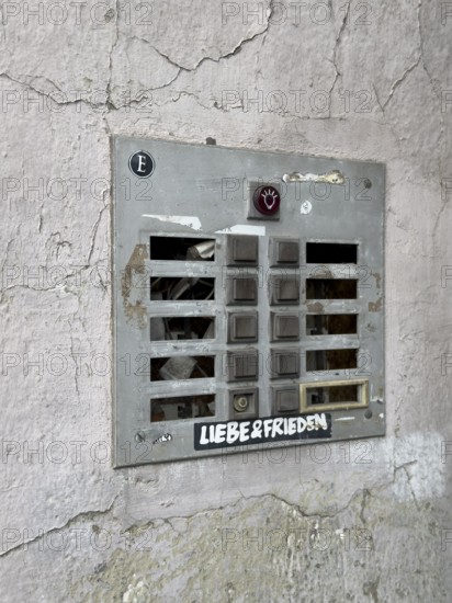 Weathered bell board without bell signs of an empty apartment building in Wuppertal, Germany