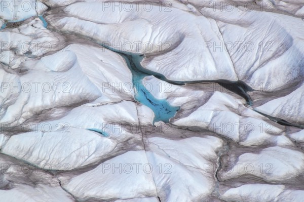 Aerial view of meltwater on the Greenland ice sheet, Arctic landscape, frozen wilderness, glaciers and snow-covered terrain, Climate change, Global warming, Greenland, North America
