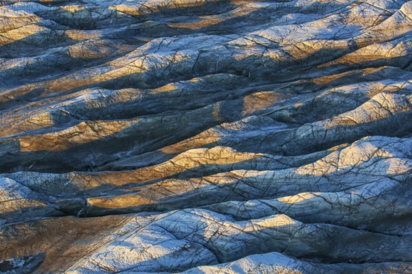 Aerial view of Ice sheet in Greenland, Arctic landscape, frozen wilderness, glaciers and snow-covered terrain, Climate change, Global warming, Greenland, North America