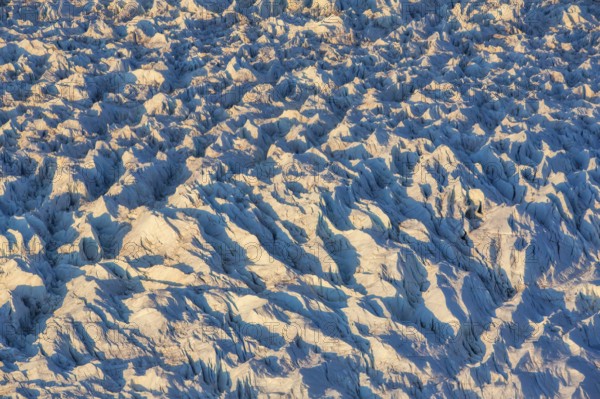 Aerial view of Ice sheet in Greenland, Arctic landscape, frozen wilderness, glaciers and snow-covered terrain, Climate change, Global warming, Greenland, North America