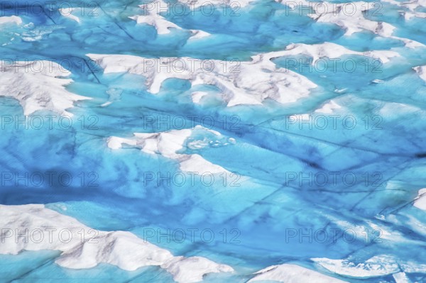 Aerial view of surface lakes (glacial/proglacial lakes), climate change, global warming, Arctic landscape with glaciers and snow-covered terrain, frozen wilderness, climate change, global warming, Greenland, geographically in North America, politically part of the Kingdom of Denmark