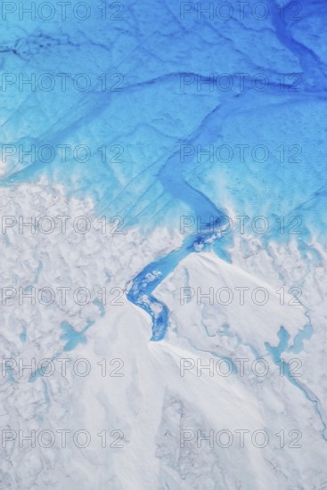 Aerial view of surface lakes (glacial/proglacial lakes) and Glacial rivers, climate change, global warming, Arctic landscape with glaciers and snow-covered terrain, frozen wilderness, climate change, global warming, Greenland, geographically in North America, politically part of the Kingdom of Denmark